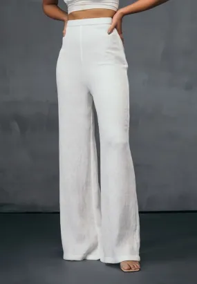 HIGH-WAISTED PLEATED PANTS IN WHITE